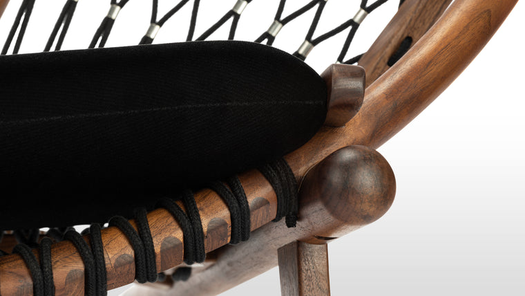 Quality Craftsmanship | The details of the Circle Chair are exquisite. From the strength of its walnut feet and frame to the meticulously woven flag halyard that delivers remarkable support, each piece of this chair is a work of art unto itself.
