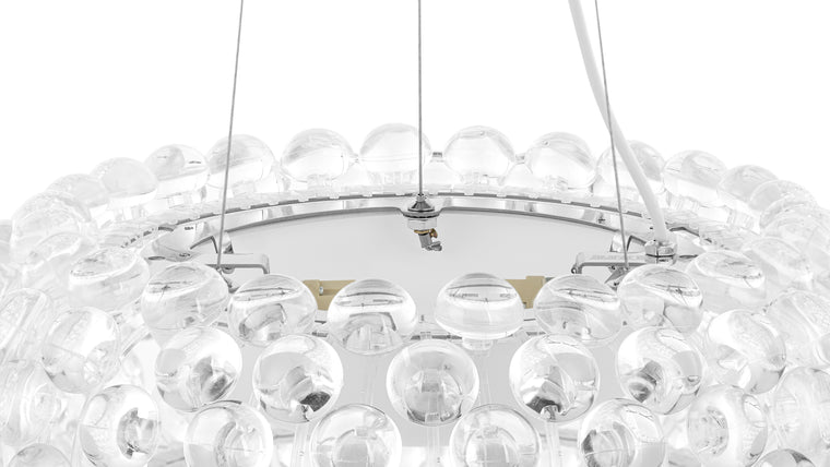 CLEARLY BEAUTIFUL | The numerous transparent spheres used to create this functional work of art let it take up less visual space, so it maintains an open, airy feel in any space.
