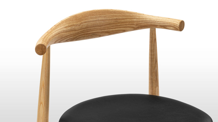 IN THE ROUND | The rounded backrest of this chair is masterfully steam-bent from a single piece of wood, giving you plenty of back support.
