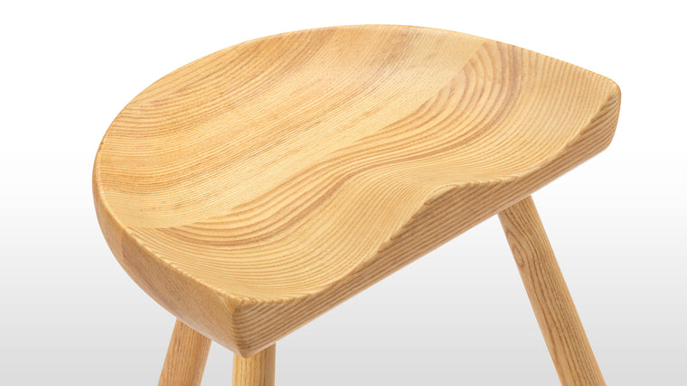Traditional Craftsmanship | Though simplistic at first take, the Shoemaker stool is a more technically challenging piece than it first appears. The seat is crafted from one solid piece of ash to perfectly accommodate the human form, and the traditional turned legs are bolstered by the aesthetic T-shaped stretcher.
