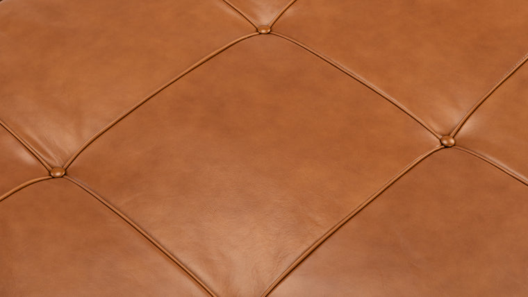 SUPERIOR QUALITY | Made with high quality, lightly tufted Italian leather and strong steel legs, this space-saving piece is equal parts luxury and function, and is built to stand the test of time.
