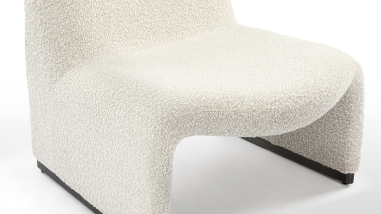Luxurious Upholstery | The Alky chair’s humble, uncomplicated form pays homage to its luxurious materials; upholstered in deluxe heavyweight boucle, this gorgeous chair is every bit as cozy as it is chic.
